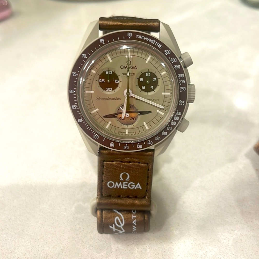 Swatch. Mission to Saturn Watch. Tan and brown